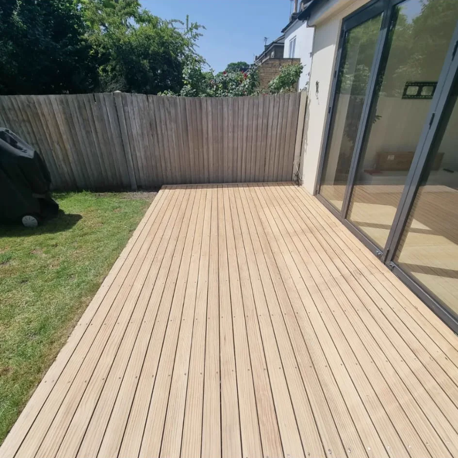 Grey weathered garden decking in Battersea SW11 before sanding, written off by its owner