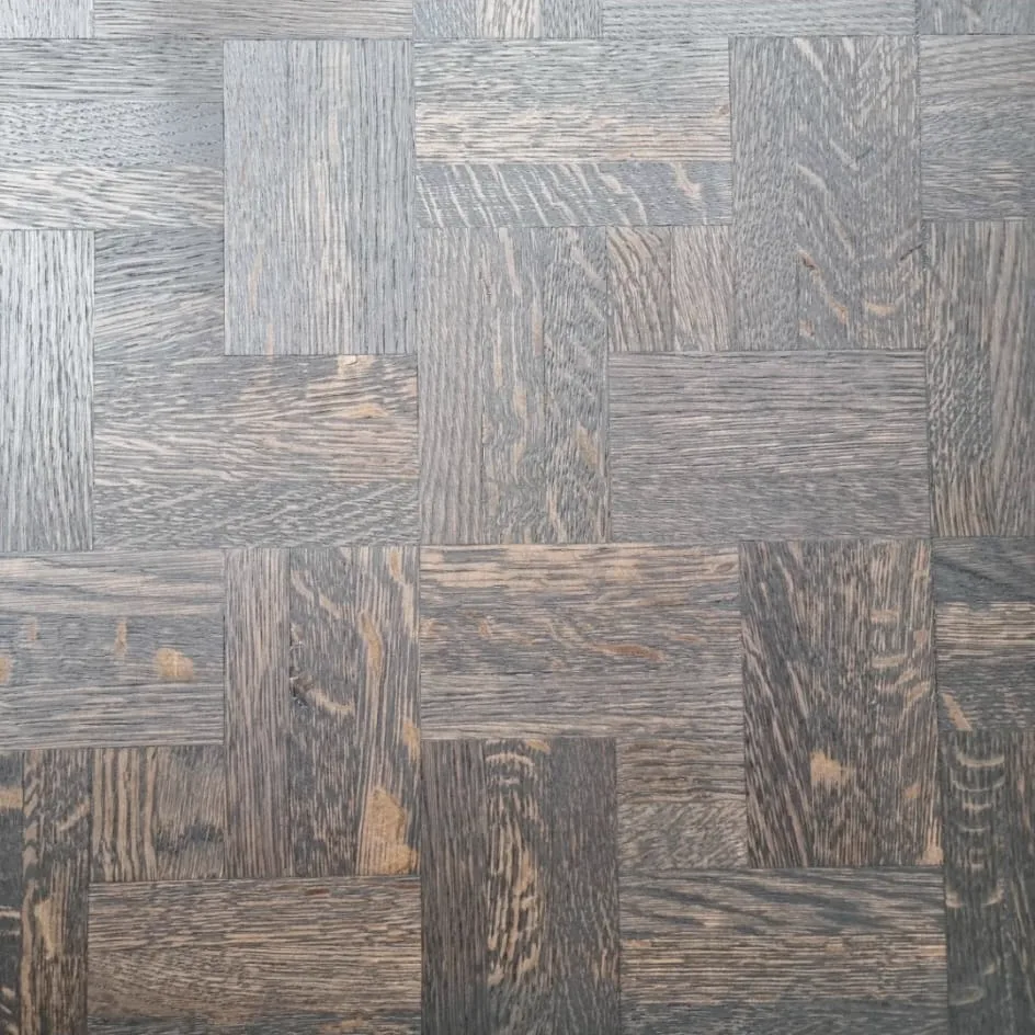 Close-up of the Chipstead CR5 finger mosaic parquet stained black, showing the grain running in different directions