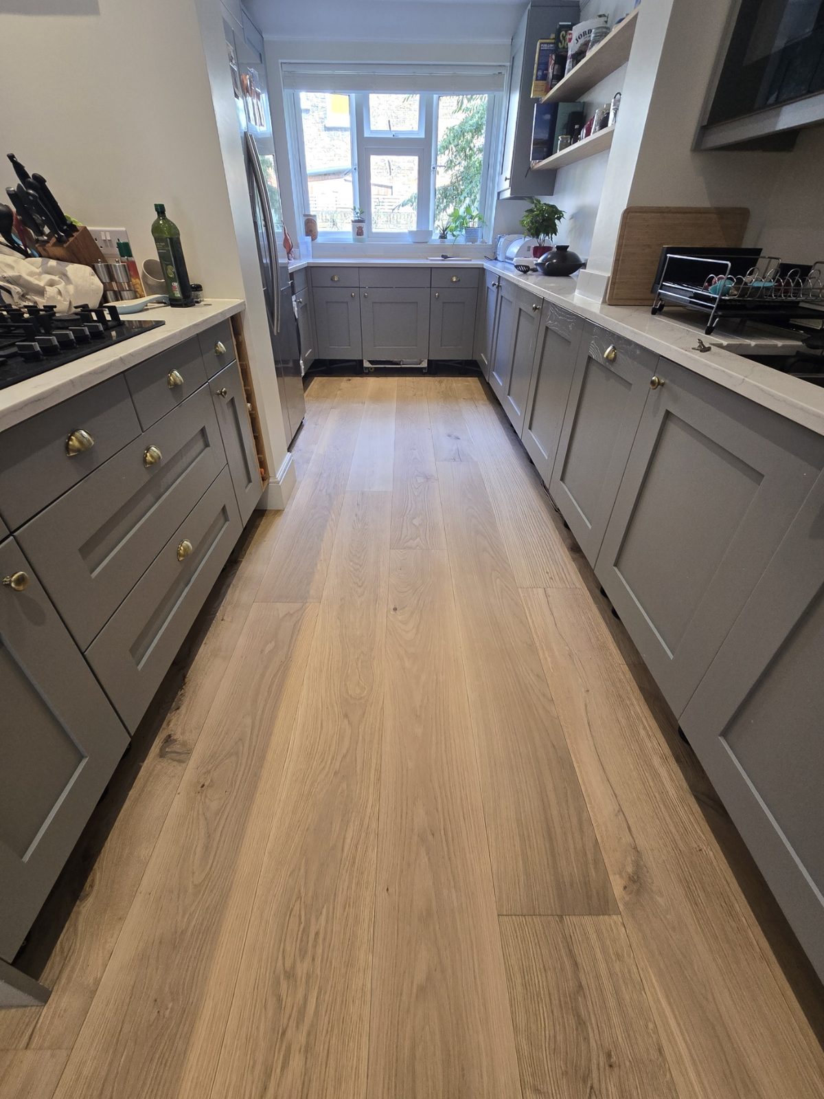 Refinished oak plank floor in a Clapham SW4 kitchen after sanding