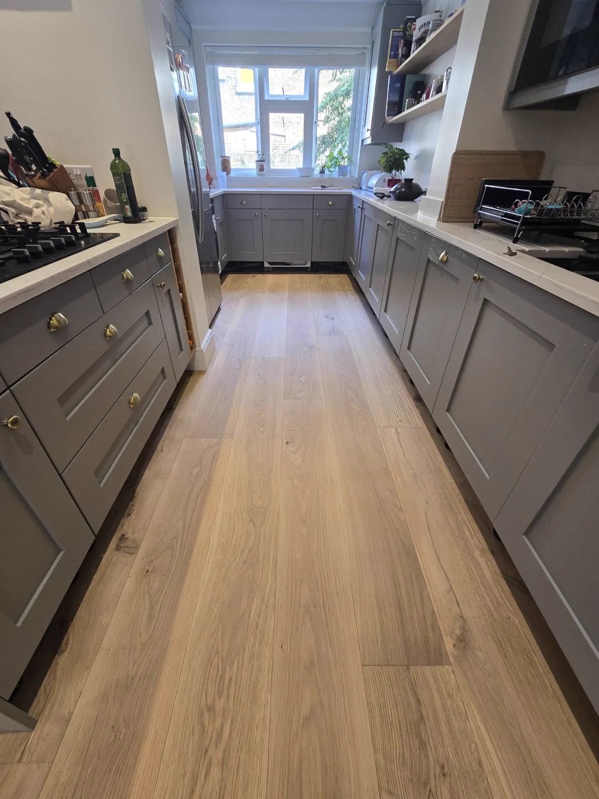 Refinished oak plank floor in a Clapham SW4 kitchen after sanding