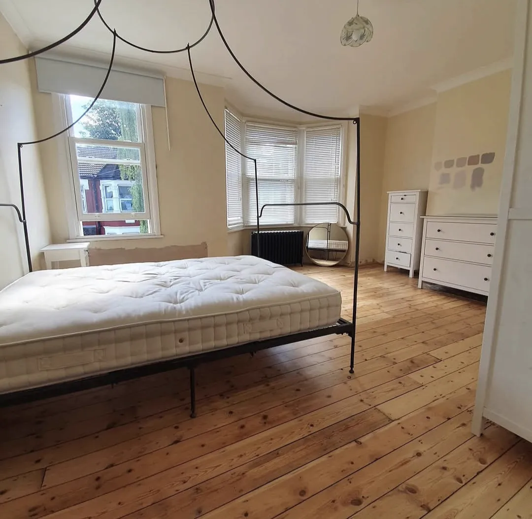 Original pine bedroom floorboards in Crystal Palace SE19 restored to warm honey pine by Howard Naish