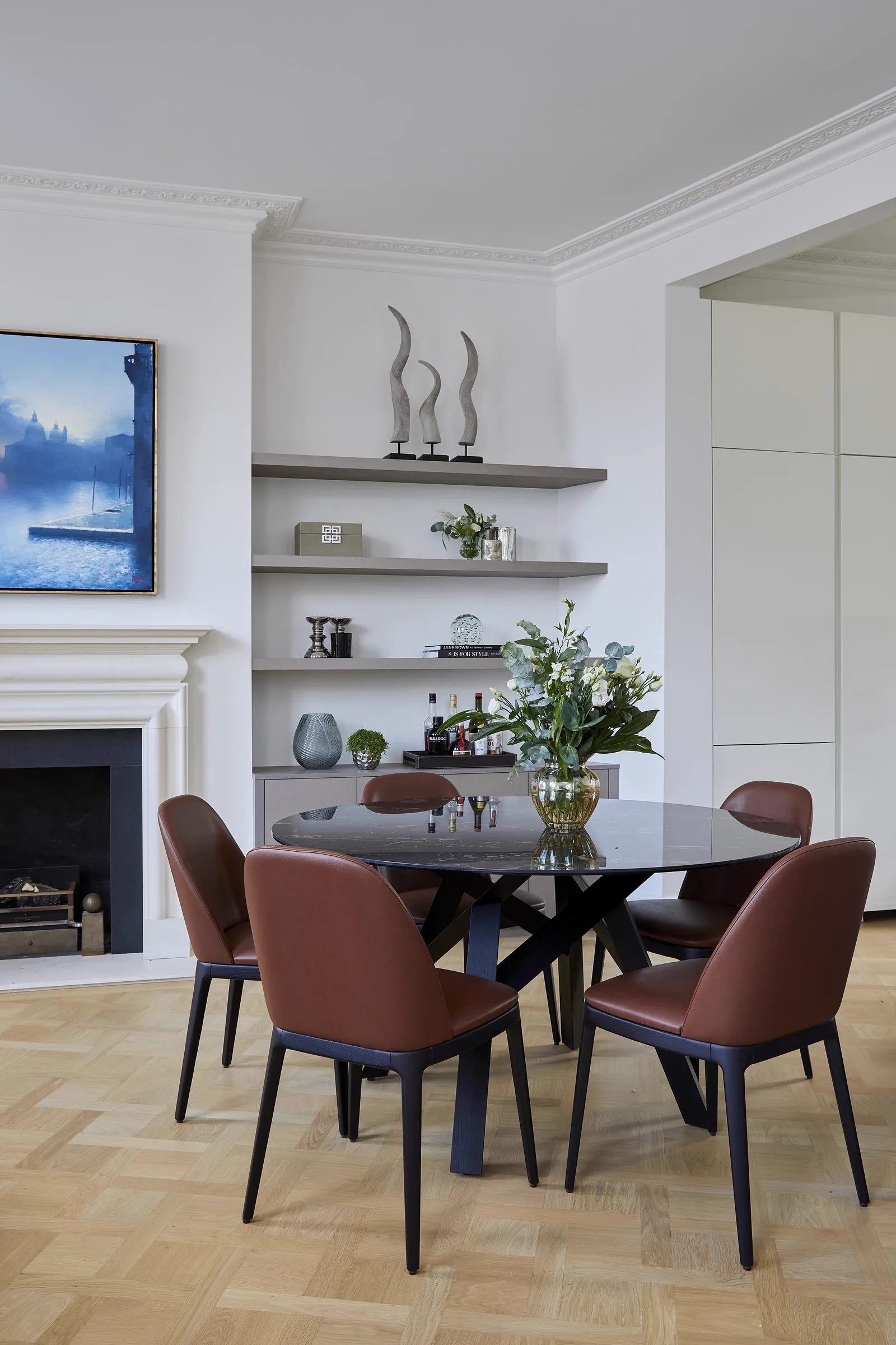 Long engineered oak planks running through a London dining room, supplied and fitted by Howard Naish