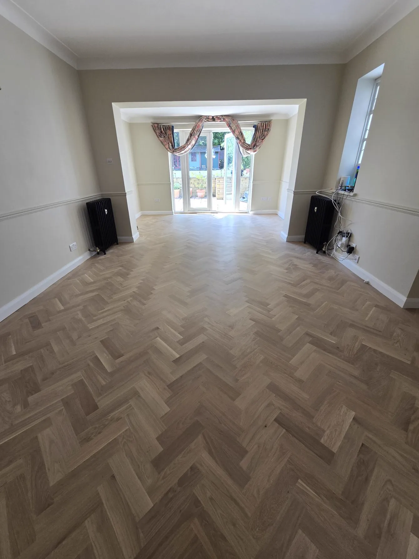 Oak herringbone parquet floor in a Purley CR8 living room, restored and refinished by Howard Naish