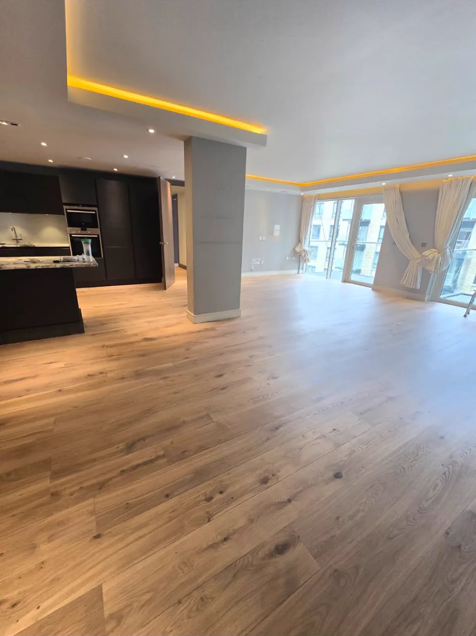 Main open-plan living floor in a Putney SW15 apartment sanded back to light natural oak by Howard Naish