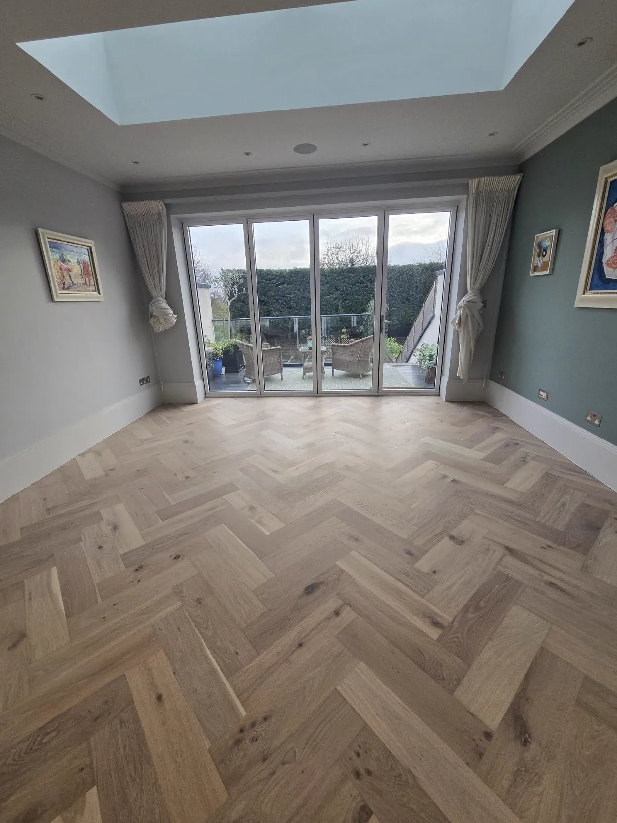 Raw-look oak herringbone floor fitted and finished by Howard Naish