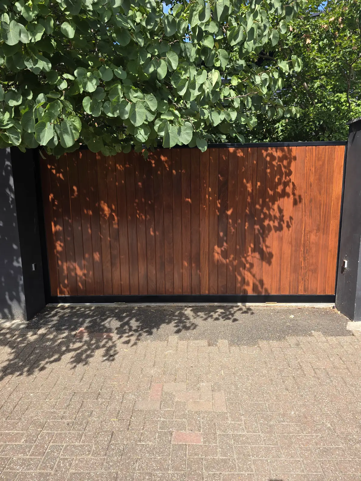 Richmond front door after hand sanding and two coats of UV-resistant oil by Howard Naish, deep rich hardwood finish