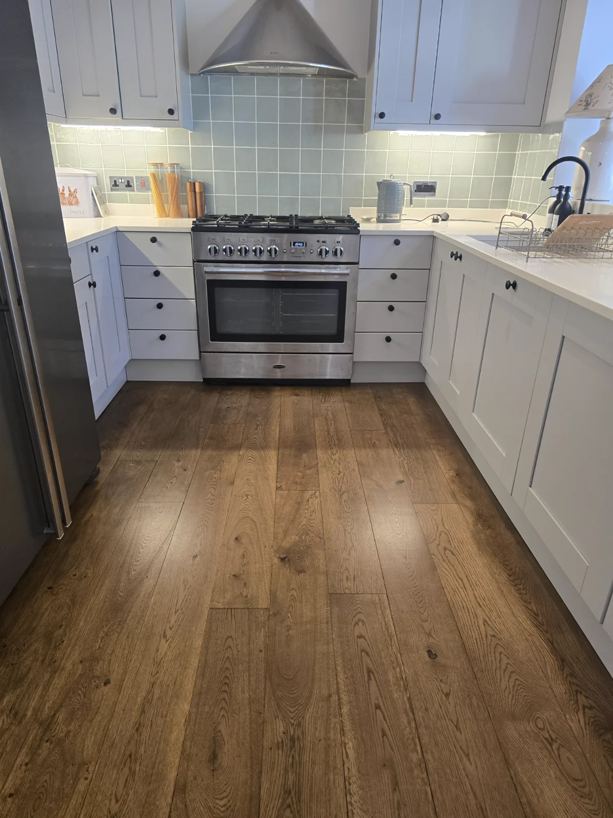 Rescued oak floor stained a weathered brown in a Southfields SW18 kitchen by Howard Naish