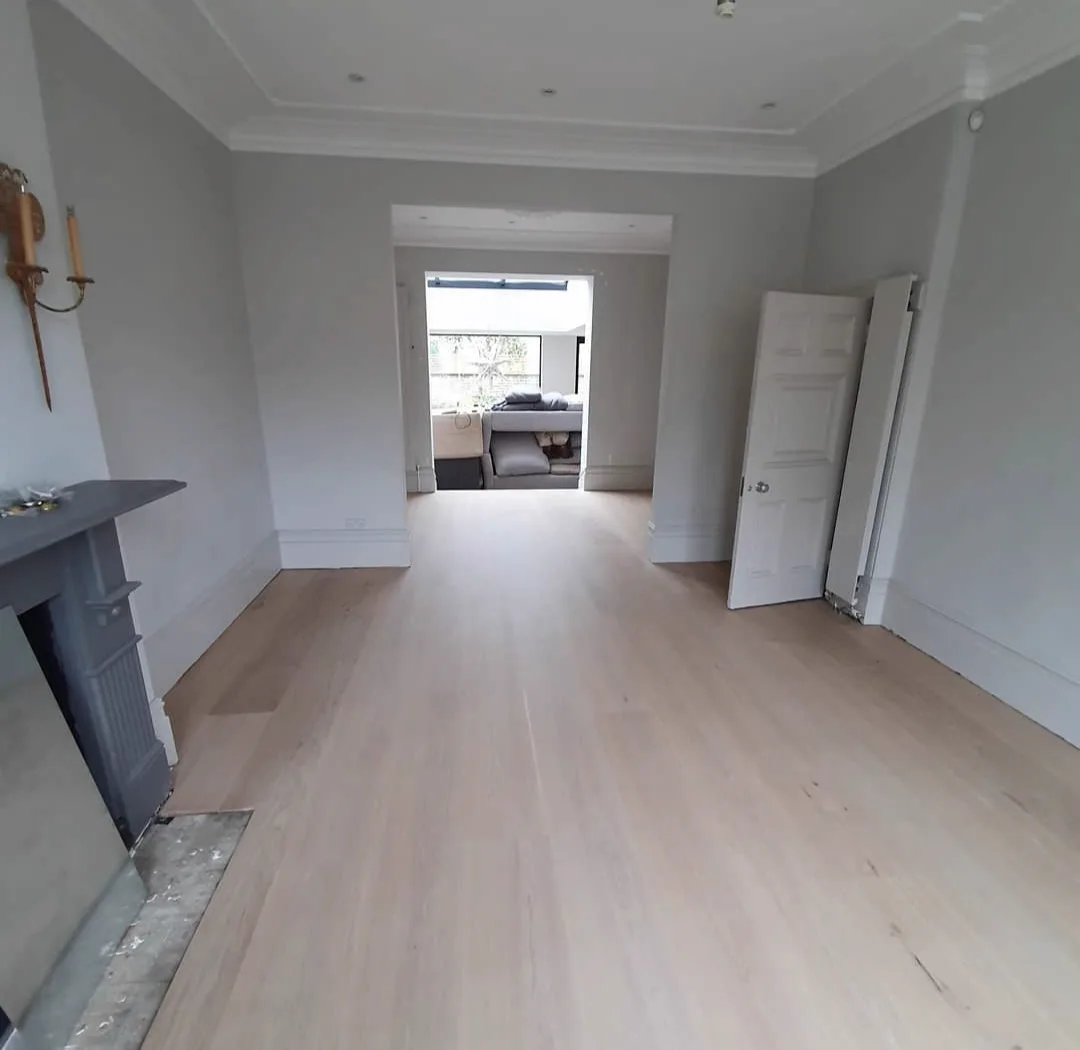 A newly supplied and fitted engineered oak floor, sanded and finished on site in a South London period home by Howard Naish
