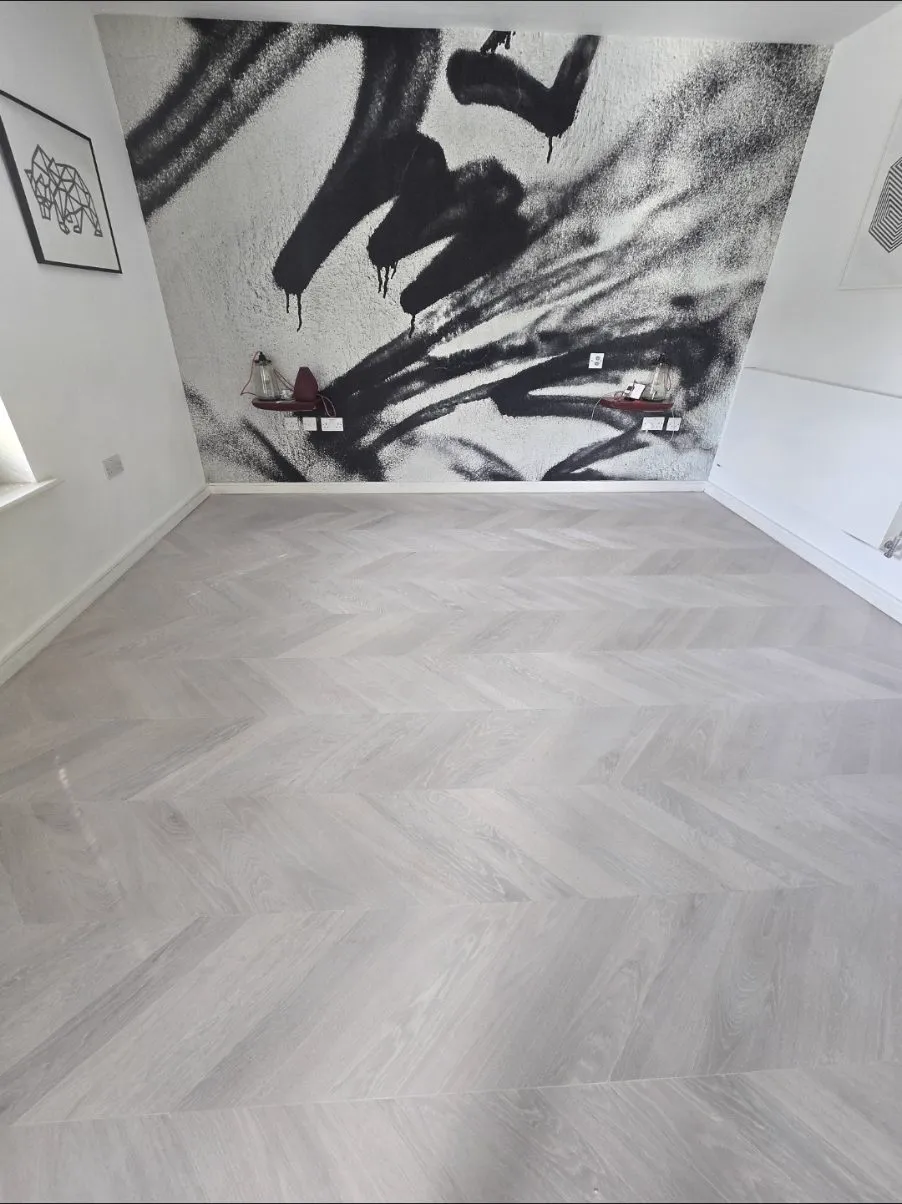 Pale grey-white oak chevron floor supplied and fitted by Howard Naish in a Camberwell home