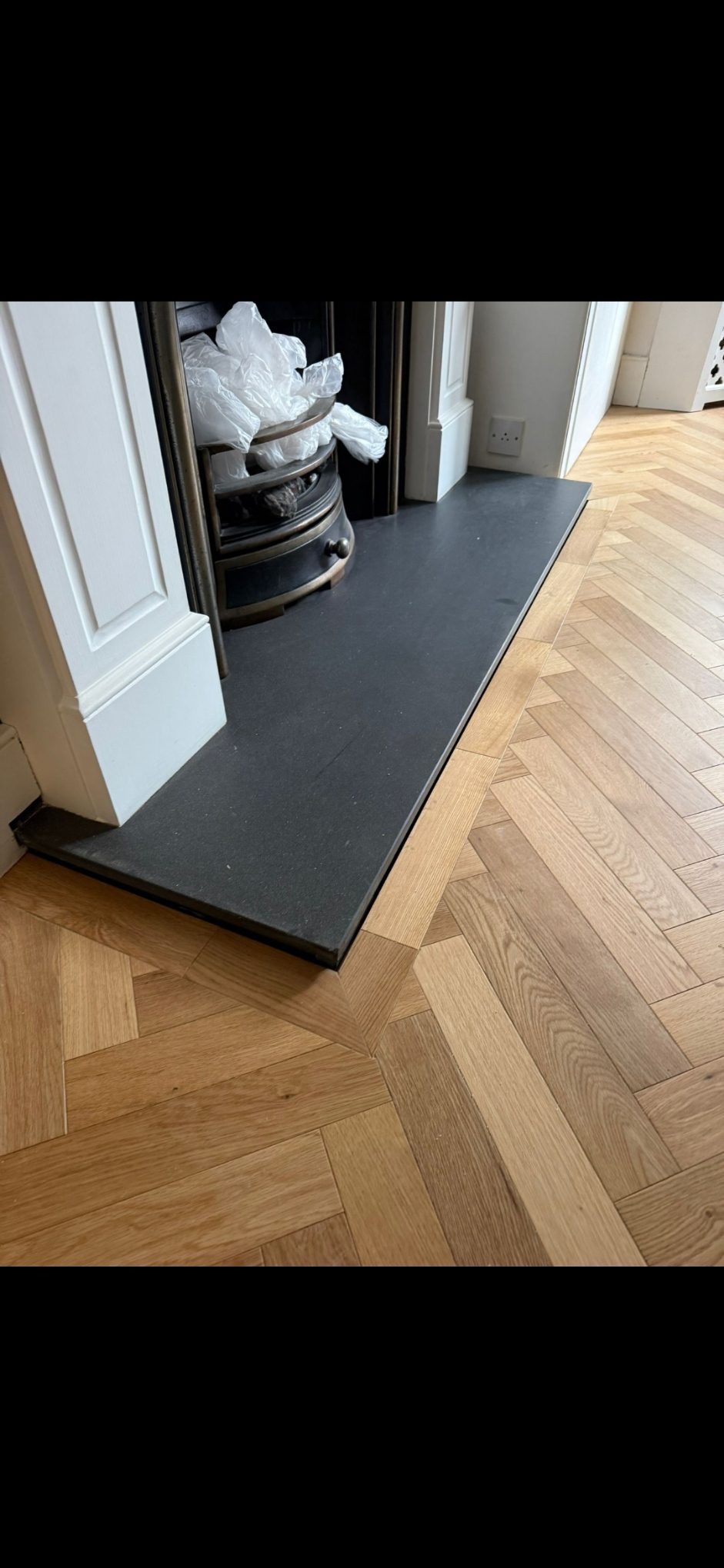 Herringbone parquet scribed to a slate hearth in Wimbledon SW19