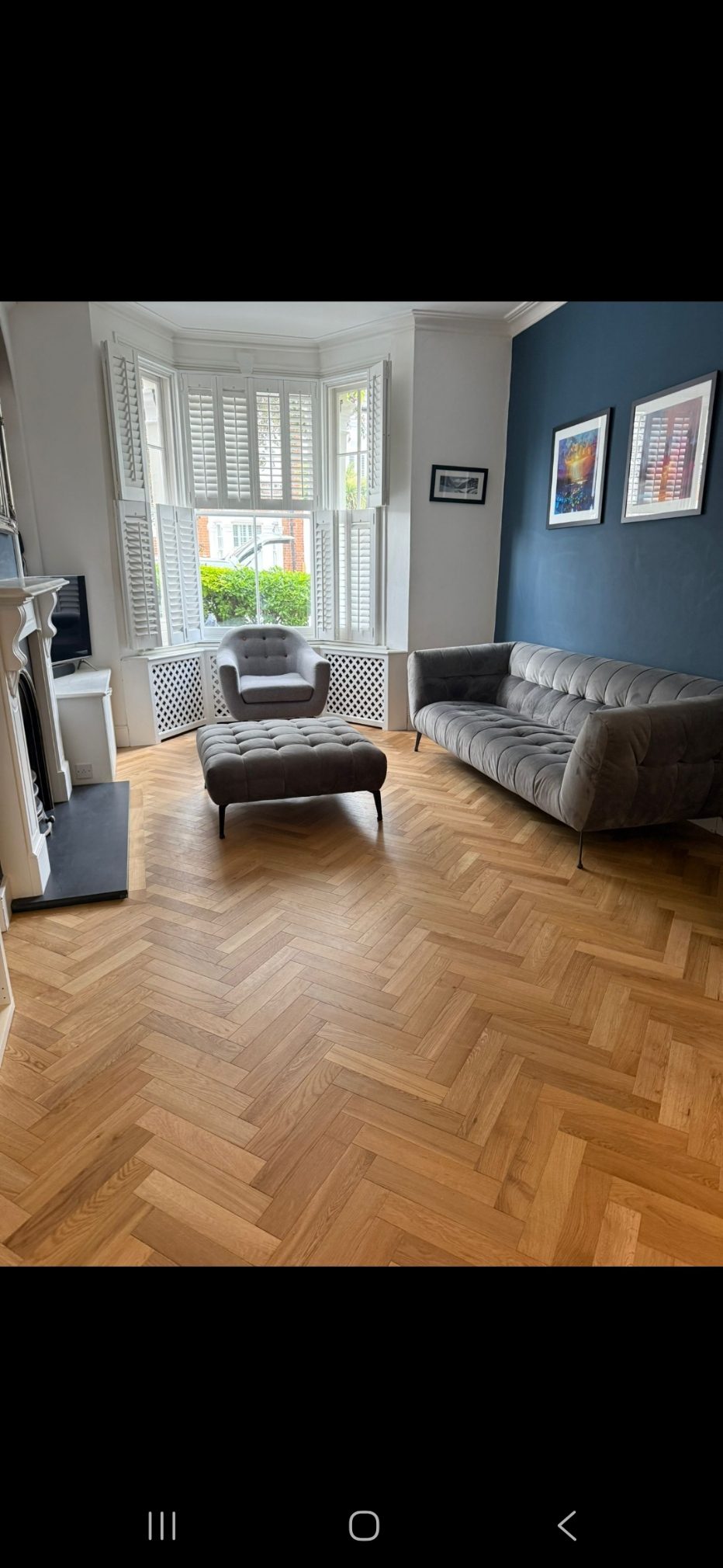 Herringbone oak parquet floor installation in a Wimbledon SW19 living room